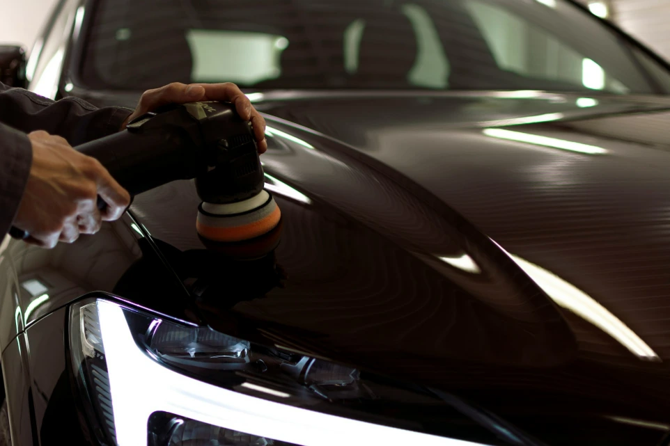 a person taking a picture of a car